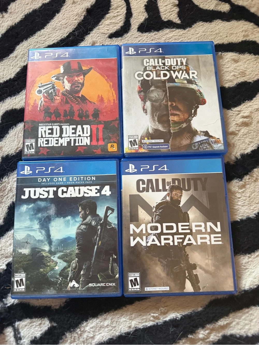 Sony PS4 Game Collection with Blue Cases - Assorted Titles